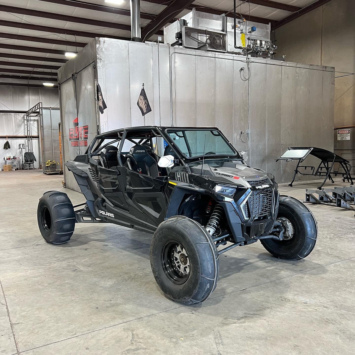 voodoo fast back roll cage installed on black polaris turbo s 